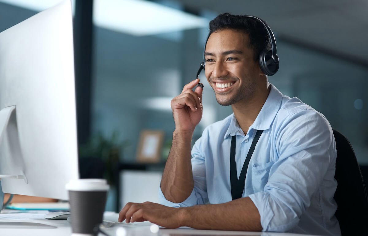 shot-of-a-young-man-using-a-headset-and-computer-i-2023-11-27-05-28-03-utc.jpg
